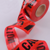 Folded close-up of red underground warning tape, flexible anti-tear for long-term underground burial against soil settlement