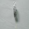 Vertical folded close-up of printed double sided tape with clear custom brand print, thin flat finish for delicate gift box inner lining