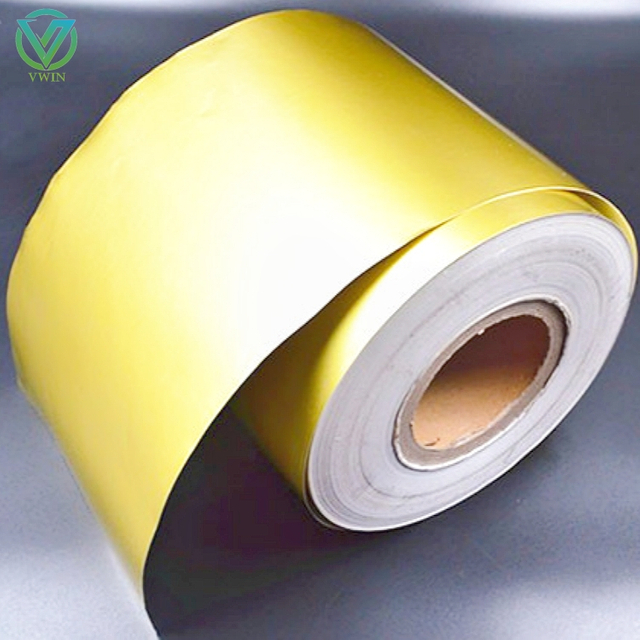 Main shot of glossy golden aluminum foil tape with release liner, high-gloss sealing tape for surface masking protection