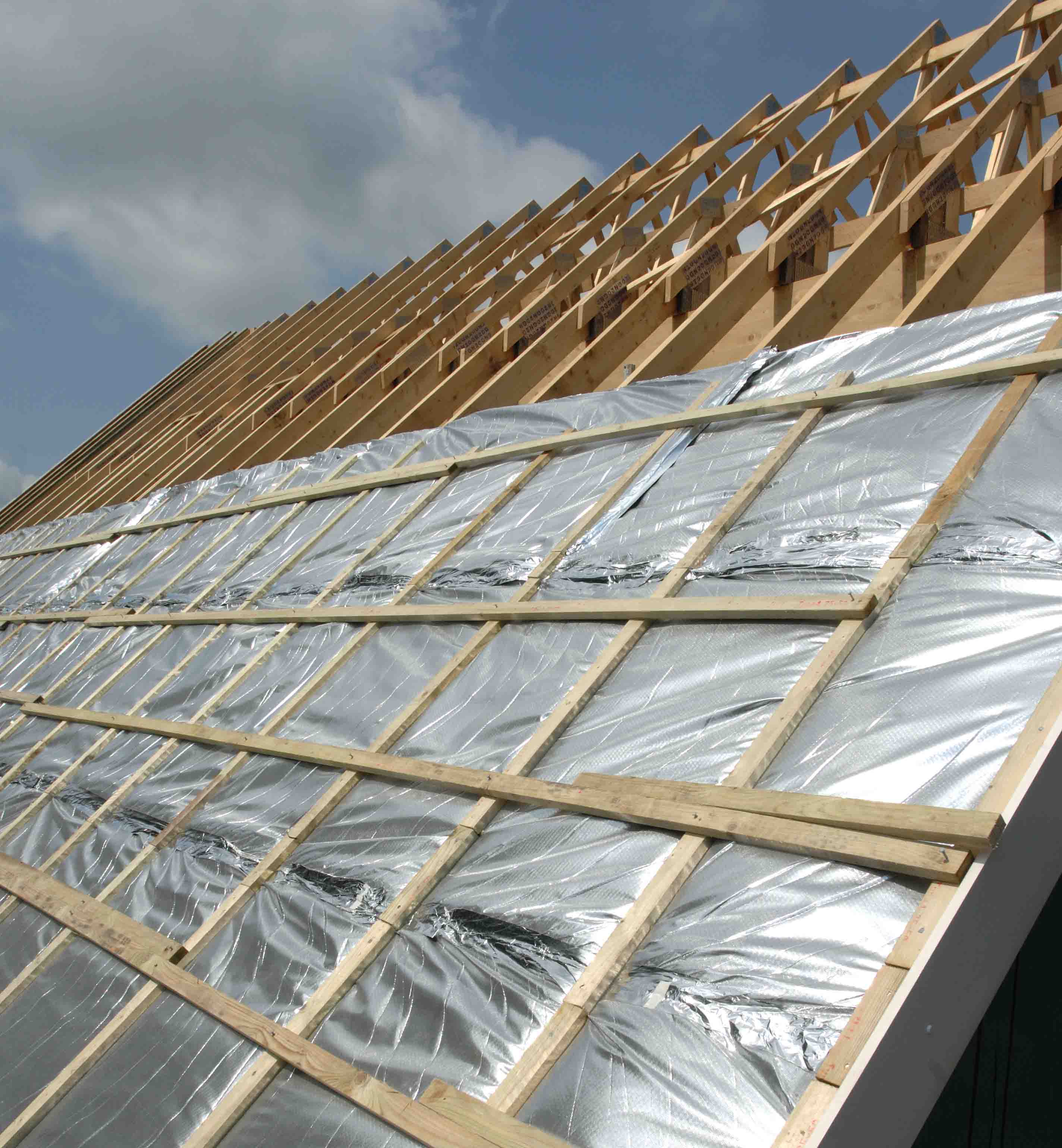 Aluminum foil woven fabric installed on building roof truss for heat reflection thermal insulation