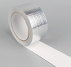 Folded texture shot of grid foil tape with white release paper, easy peel for fast pipe soundproof construction lapping
