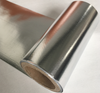 Roll cross-section layered close-up, dual aluminum + woven core composite conformable for irregular roof & pipe radiant wrapping