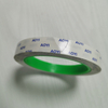 Medium-width transparent printed double sided tape laid flat, flexible for curved cosmetic & jewelry gift box mounting
