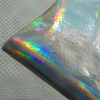 Flat iridescent texture shot of laser aluminum woven fabric, scratch waterproof composite for jewelry & souvenir luxury gift wrapping decoration