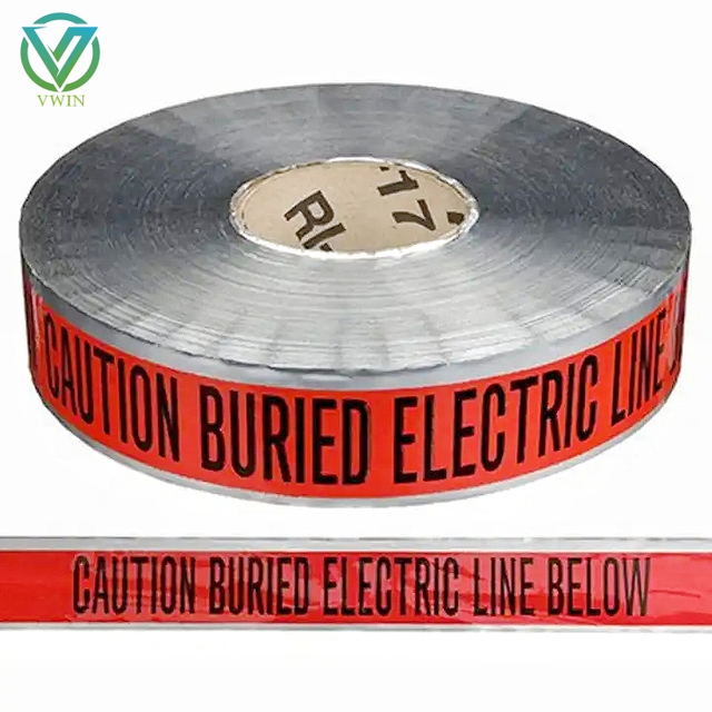 Main shot of underground electrical warning barrier tape, red printed tape buried above cables to mark hidden power lines for excavation safety