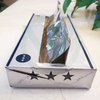 Close-up of premium white box with star patterns, highlighting the exquisite look of the product
