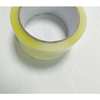 Medium-width pale yellow silent linerless tape curved shot, quiet tear for daily small parcel packing, no waste release liner to dispose