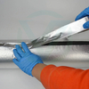 On-site construction scene where workers wrap engine high-temperature pipelines with gold aluminum foil fiberglass tape
