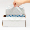 Dynamic shot: Hand easily pulling aluminum foil sheets from a white box, demonstrating user-friendly design