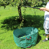Open-top PE coated woven leaf bag under tree, wide mouth for fast loading garden fallen leaves