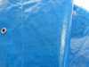 Close-up of waterproof film surface on reinforced blue woven fabric, impermeable & anti-aging for long outdoor use
