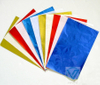 Fanned out display of rainbow multi-color square aluminum foil sheets, rich colors for various scenarios