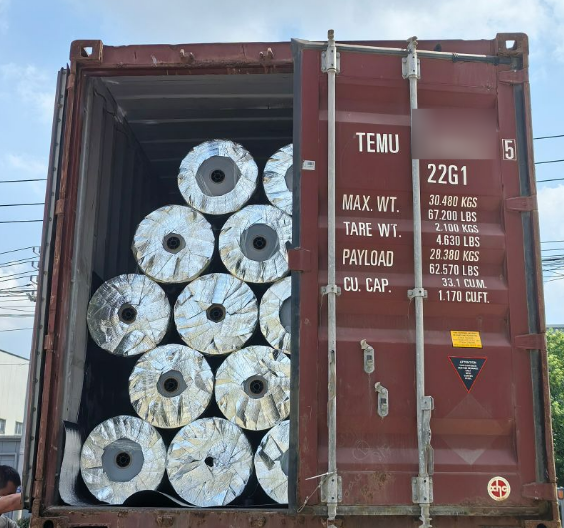 Full container loaded with PET aluminum foil PE composite film rolls for Australian food packaging client