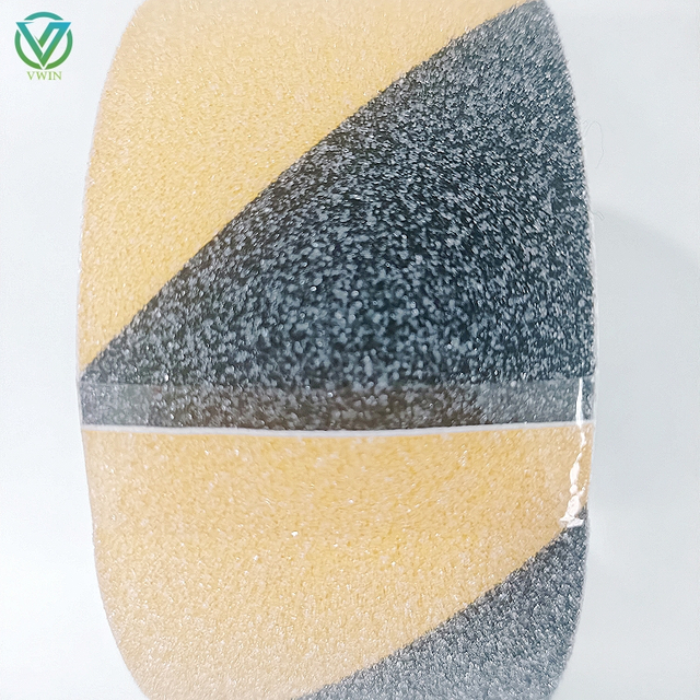 Main shot of black-orange warning anti slip tape, high-friction surface for prominent anti-slip warning in hazardous areas & equipment steps