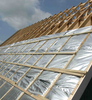 Roof construction shot of reflective MPET woven cloth, works with bubble wrap for roof thermal & moisture insulation