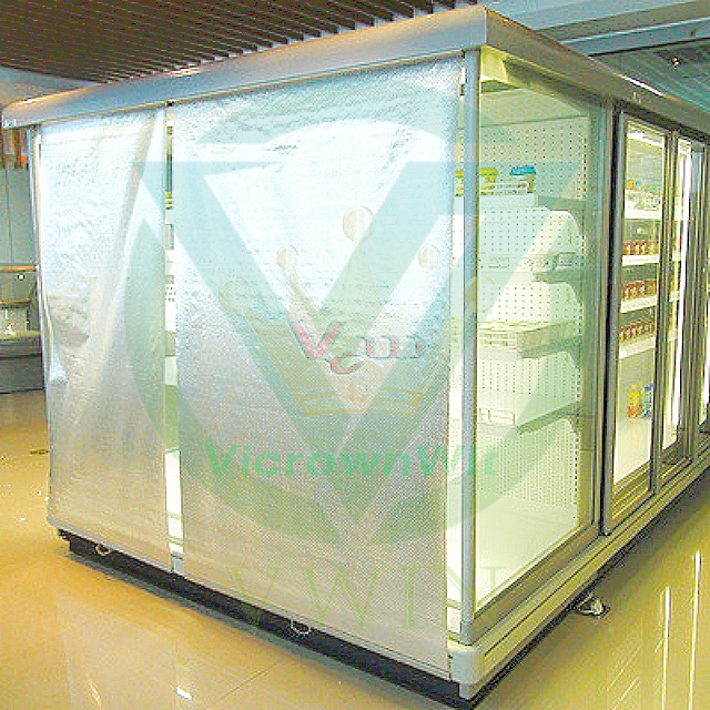 Real‑scene photo of silver perforated anti‑condensation night blind installed on freezer