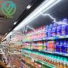 Solid plastic night cover fitted on commercial freezer inside supermarket retail store