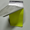 Diagonal folded shot of green high temp fiberglass foil tape, reflective foil for equipment pipe vapor barrier insulation