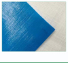 Grid texture close-up of blue fire-resistant woven fabric, high density for tear resistance during roof wrapping