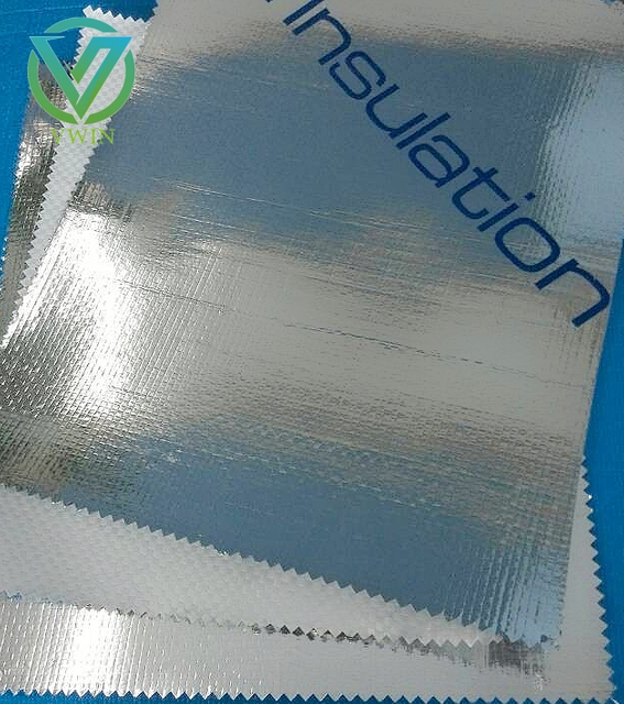 Roll side close-up of double aluminized VMPET fabric, dual vapor & heat barrier composite for roof, wall and pipe insulation wrapping
